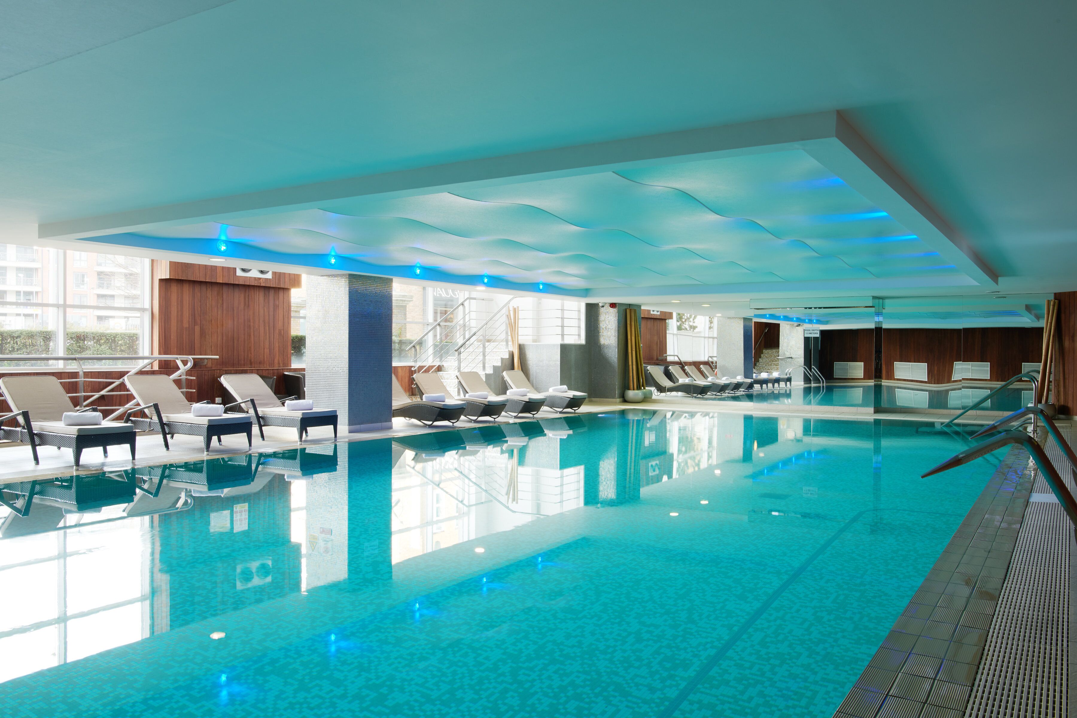 Indoor pool, open 8:00 AM to 8:00 PM, pool loungers