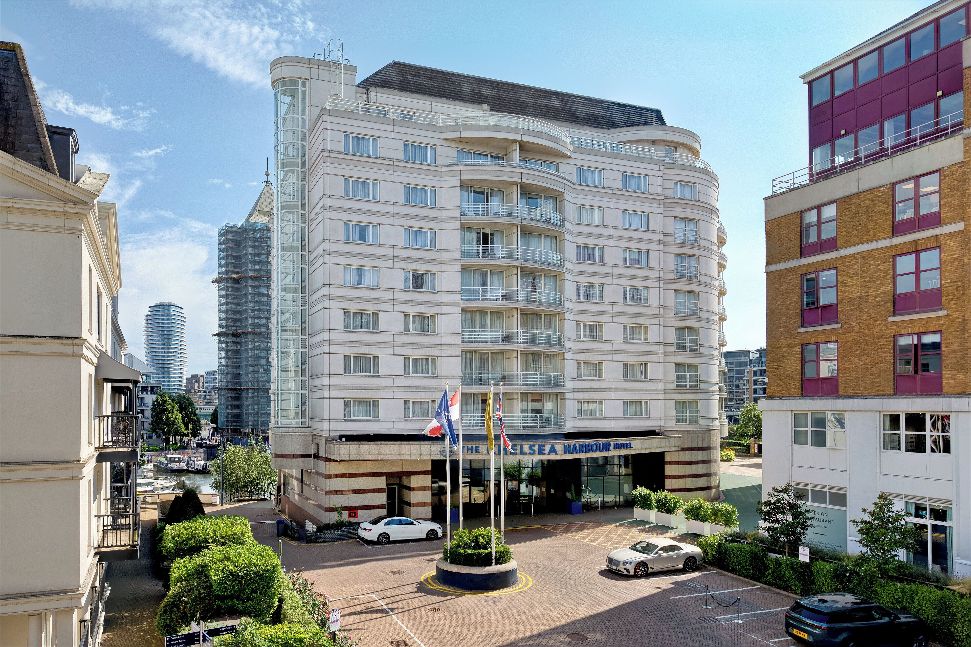 A hotel with a central courtyard, multiple floors, and a prominent entrance.
