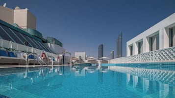 Outdoor pool, pool umbrellas, sun loungers
