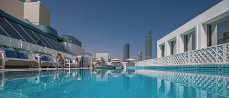 Outdoor pool, pool umbrellas, sun loungers