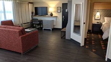 Desk, laptop workspace, blackout drapes, iron/ironing board