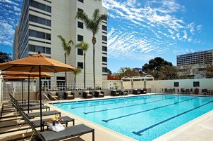 Outdoor pool, open 10:00 AM to 10:00 PM, pool umbrellas, sun loungers