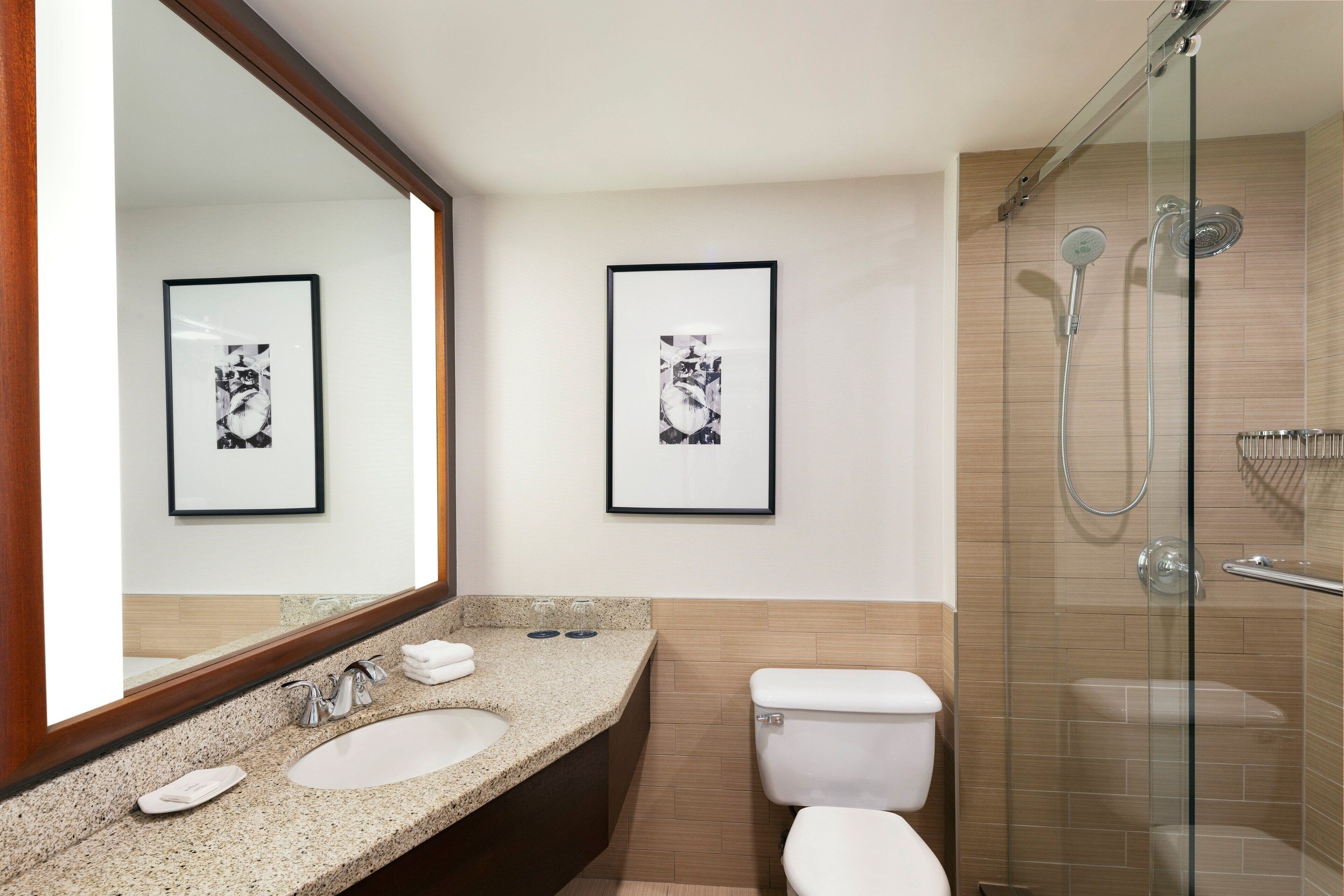 combined shower/bathtub, deep-soaking bathtub, designer toiletries