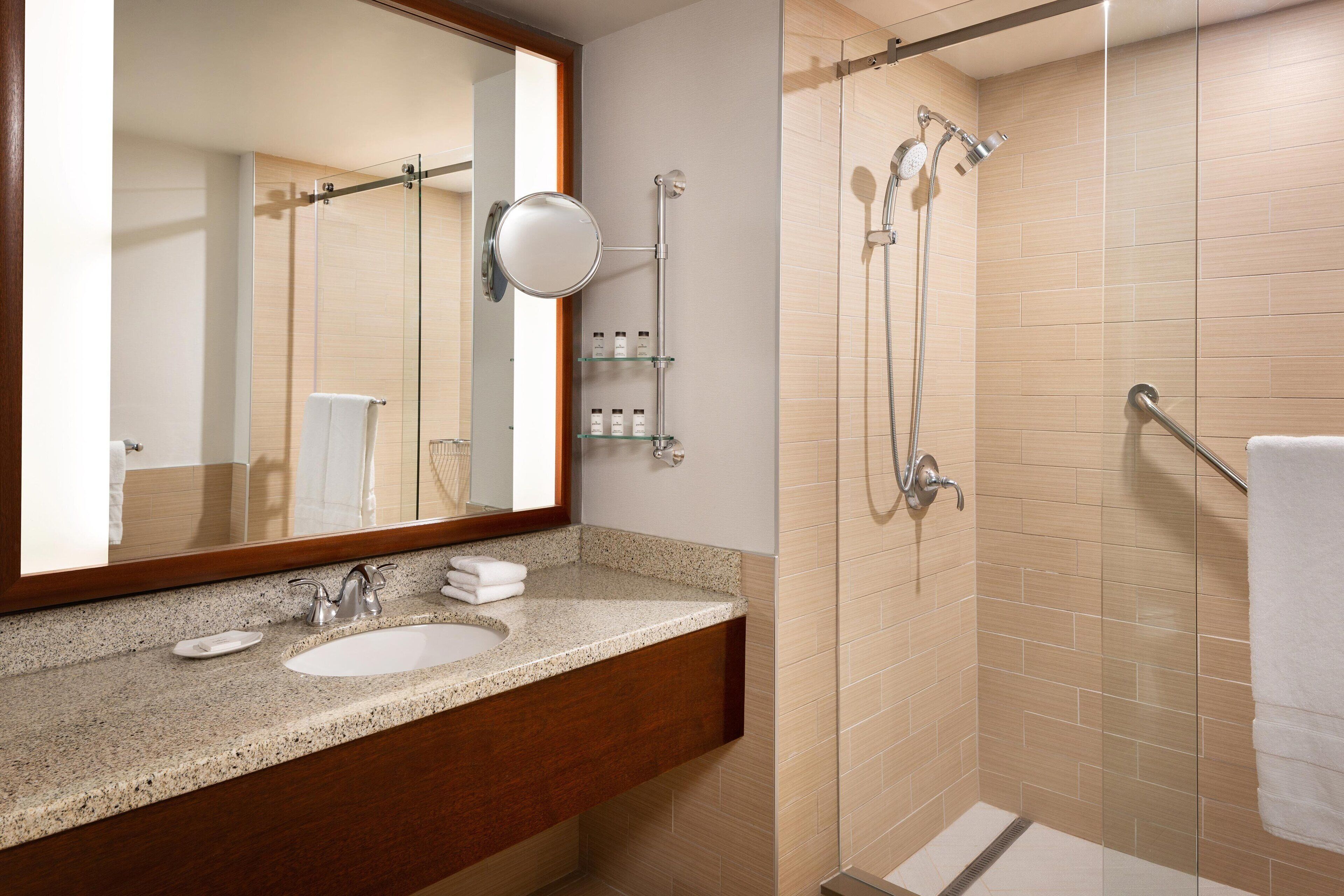 junior suite, 1 king bed, non smoking, balcony | bathroom | combined shower/bathtub, deep-soaking bathtub, designer toiletries
