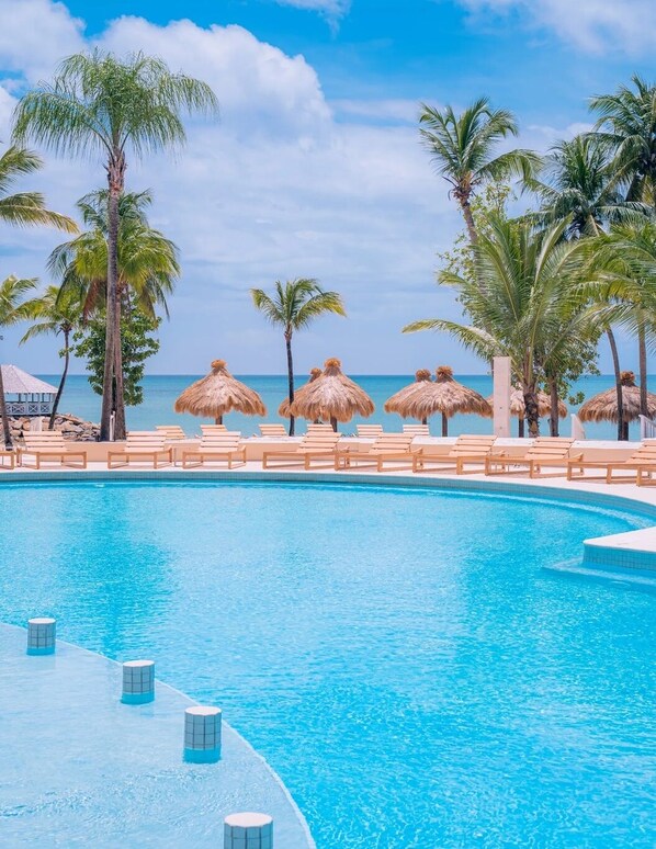 3 outdoor pools, open 7:00 AM to 7:00 PM, pool umbrellas, pool loungers