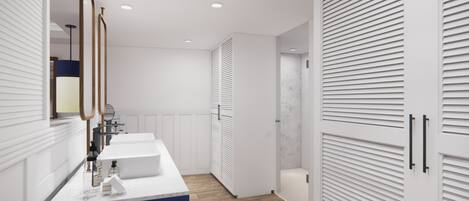 A modern bathroom with a white vanity, a mirror, and a blue accent wall.