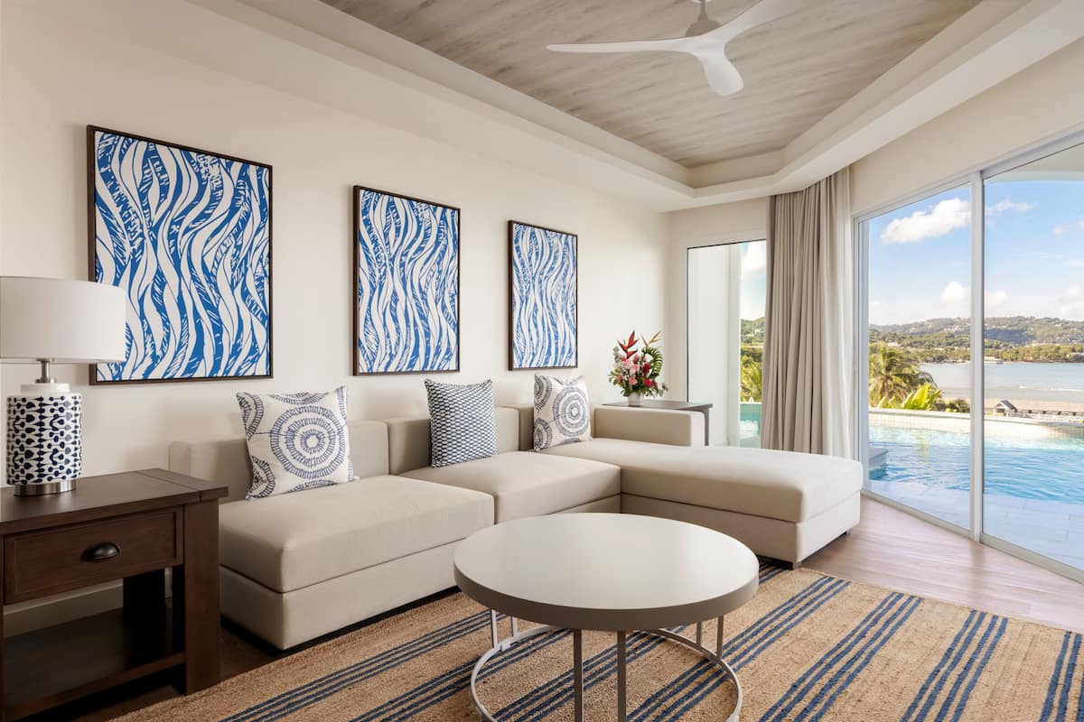 Preferred Club Imperial Suite Swim Out King | Living area | 45-inch flat-screen TV with satellite channels, TV, books