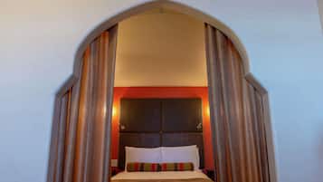 Premium bedding, down comforters, pillowtop beds, in-room safe