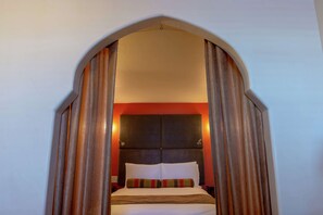 Premium bedding, down comforters, pillowtop beds, in-room safe