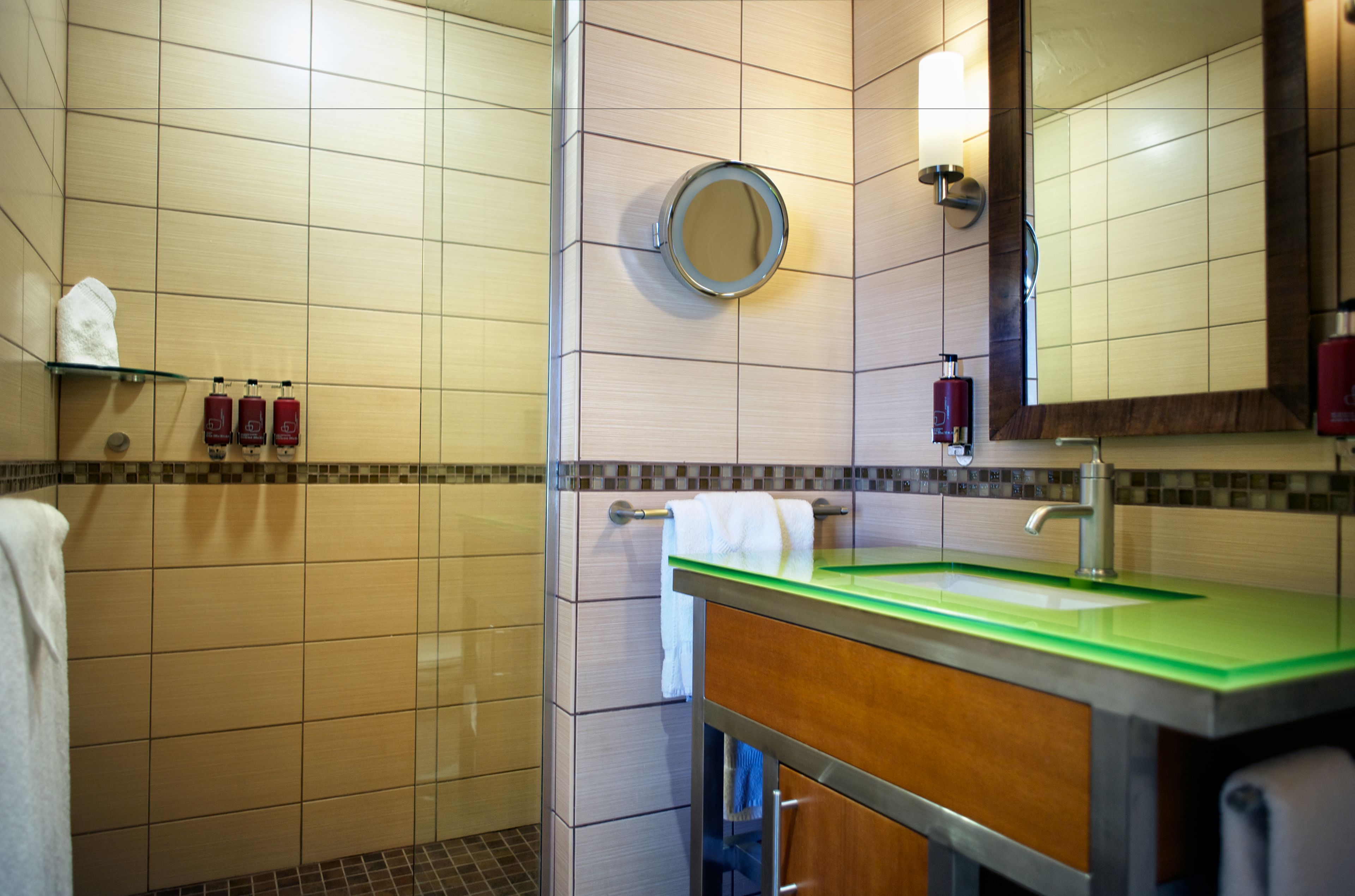 combined shower/bathtub, designer toiletries, hair dryer, bathrobes