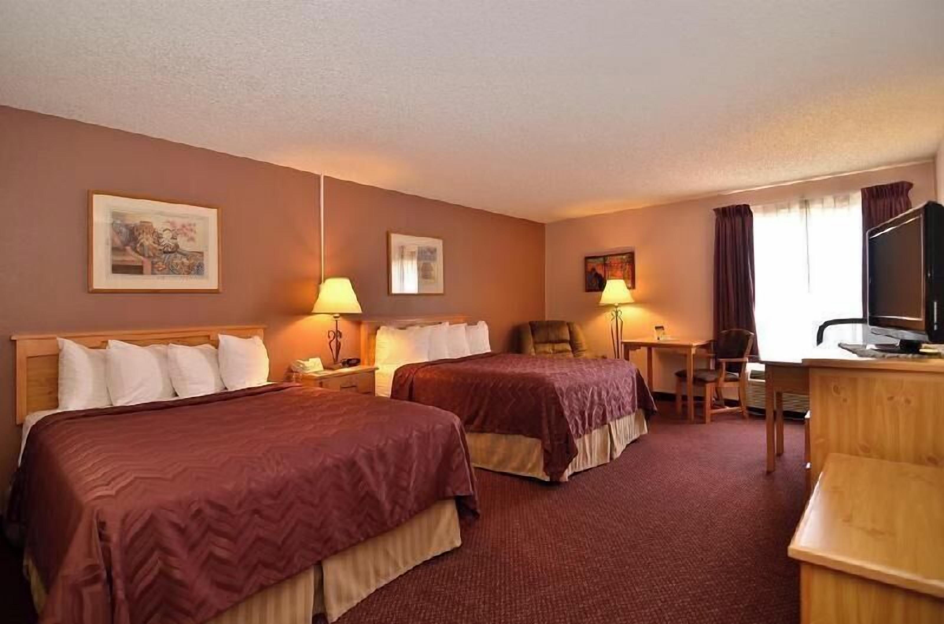 Desk, laptop workspace, iron/ironing board, free cots/infant beds