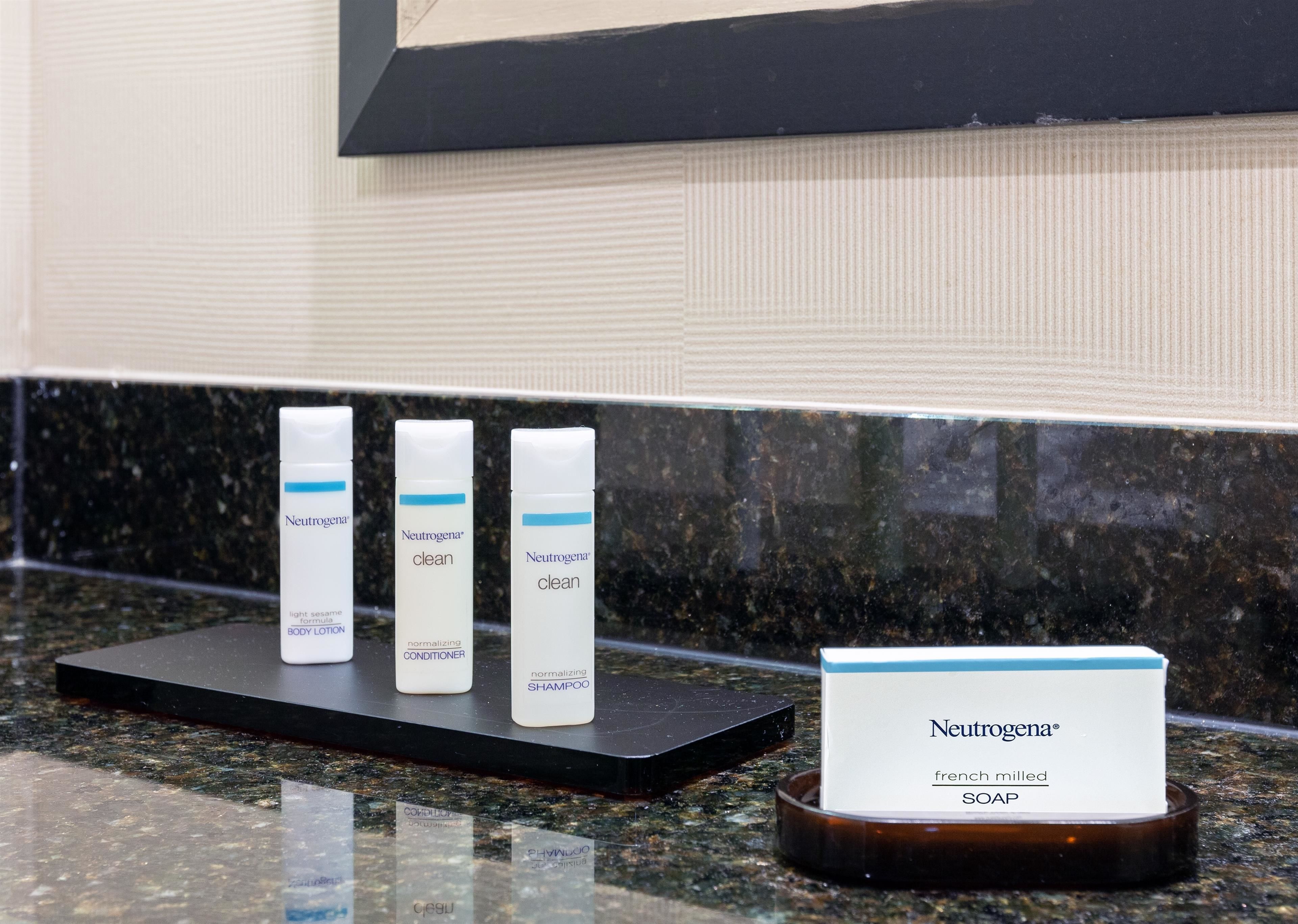 designer toiletries, hair dryer, towels