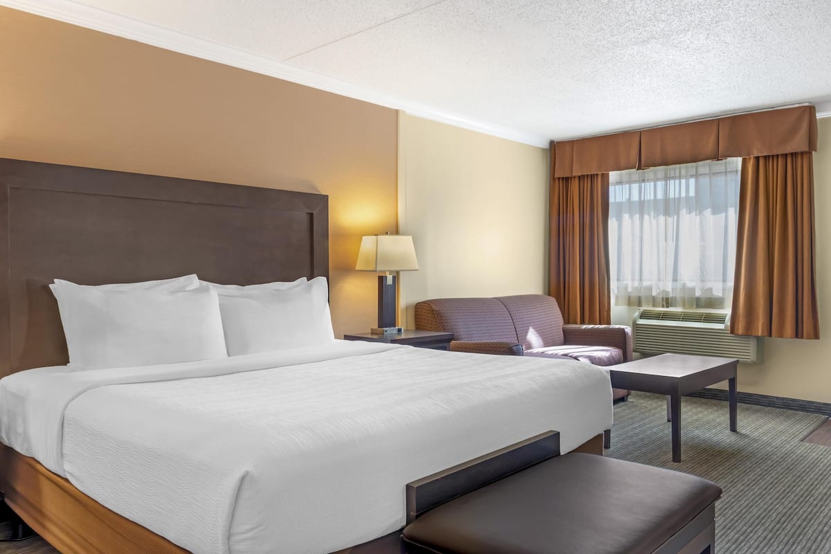 Premium bedding, desk, laptop workspace, iron/ironing board