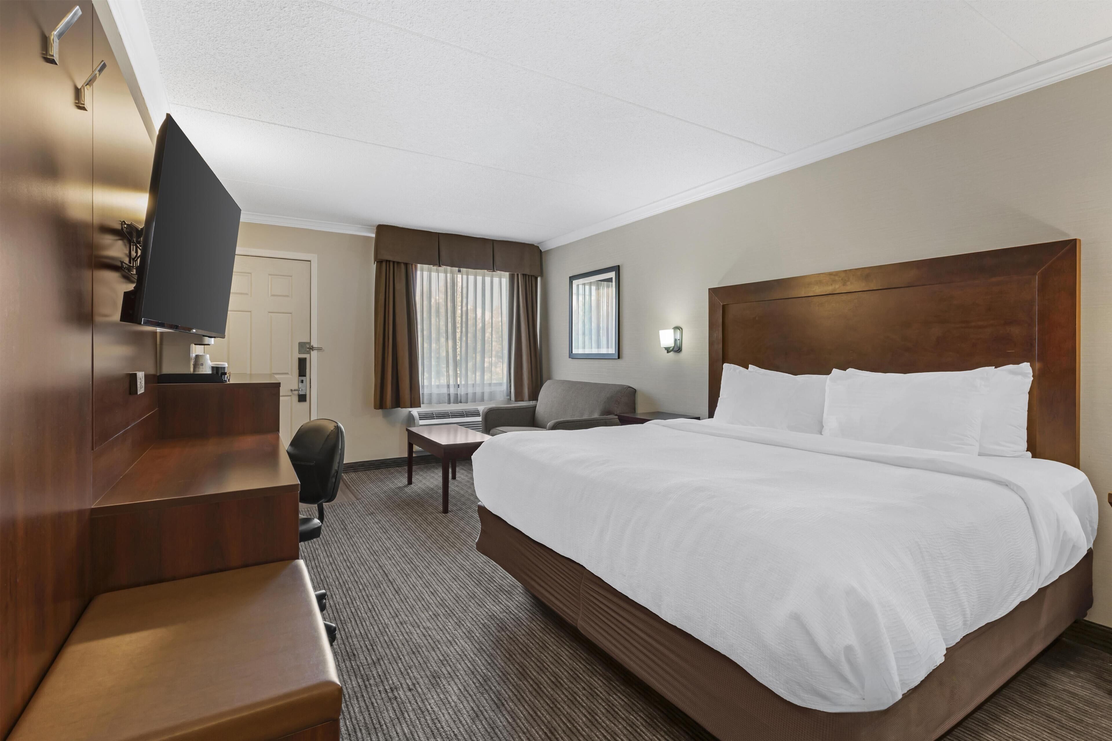 Premium bedding, desk, laptop workspace, iron/ironing board