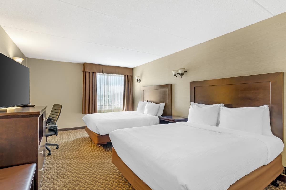Premium bedding, desk, laptop workspace, iron/ironing board