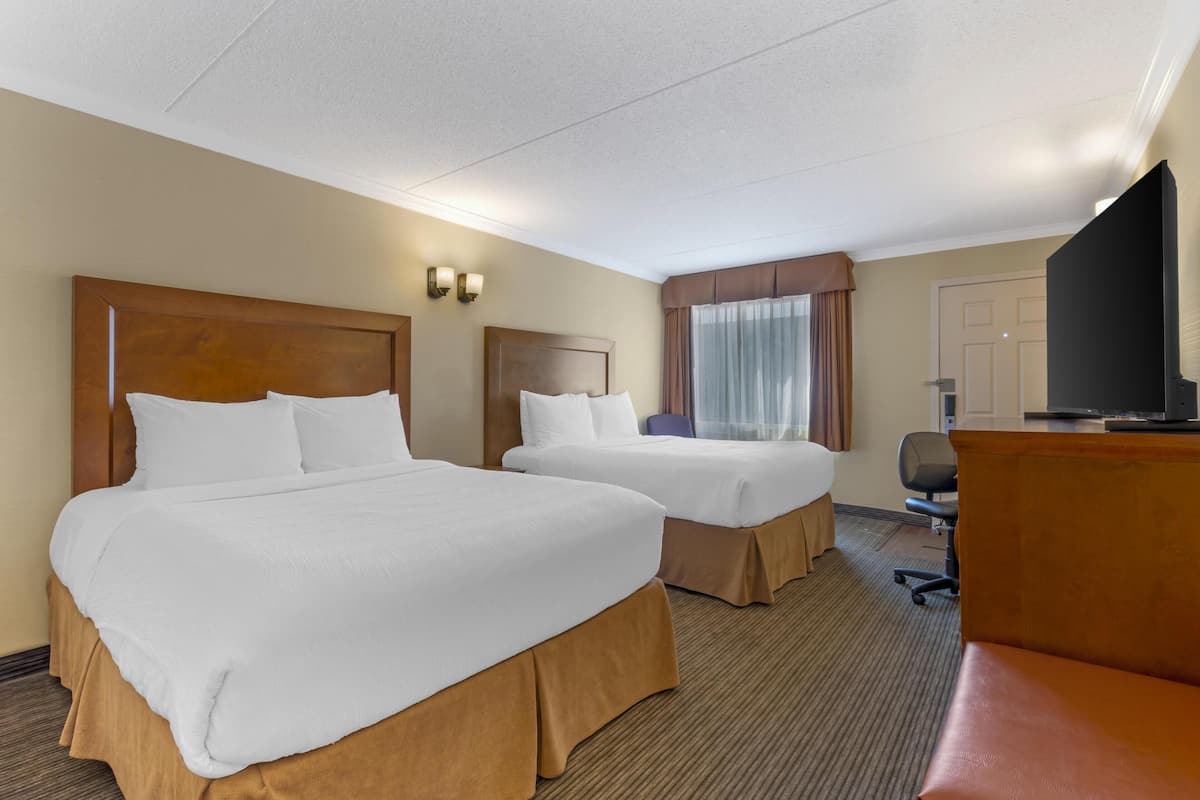 Premium bedding, desk, laptop workspace, iron/ironing board