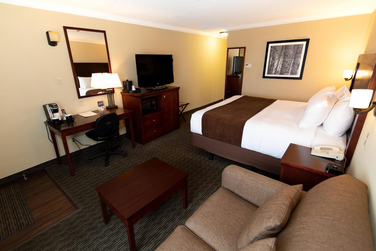 Premium bedding, desk, laptop workspace, iron/ironing board