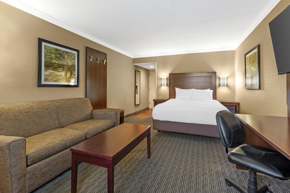 Premium bedding, desk, laptop workspace, iron/ironing board