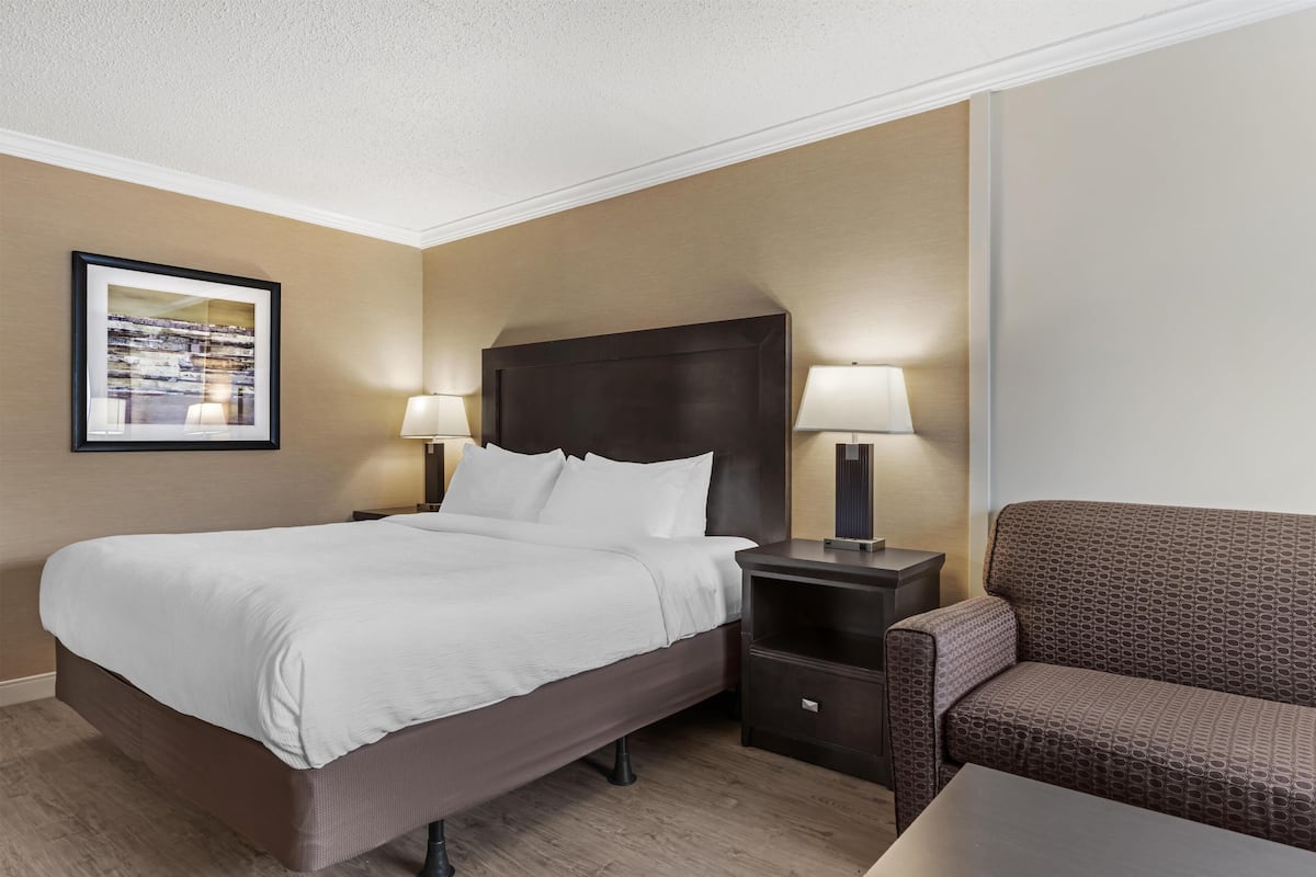 Premium bedding, desk, laptop workspace, iron/ironing board