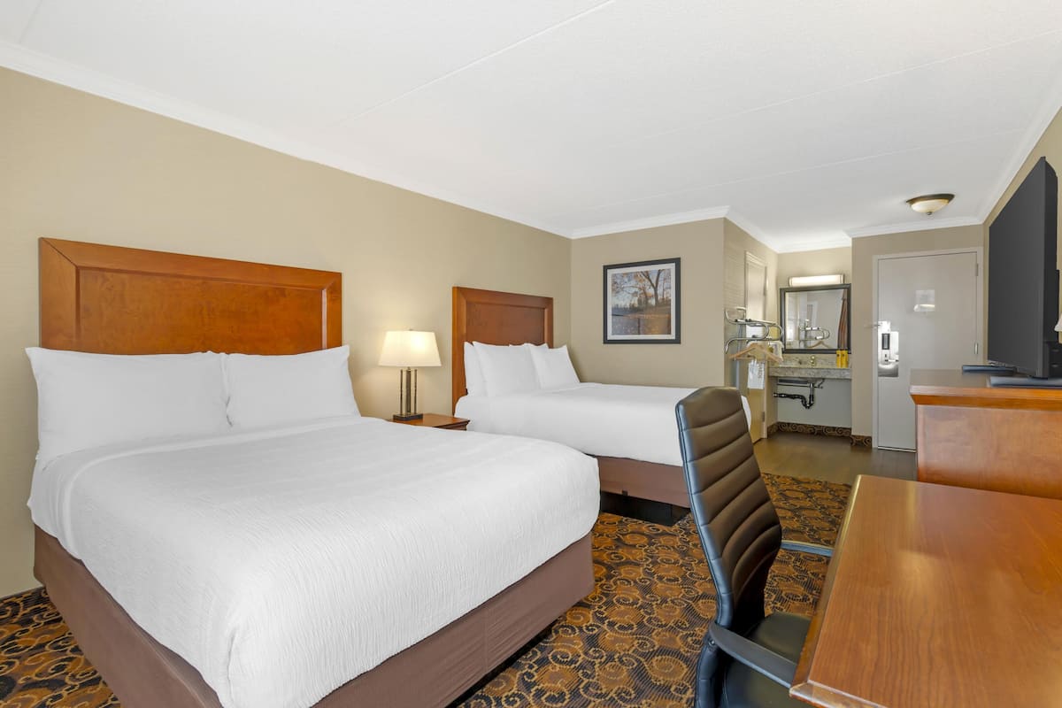 Premium bedding, desk, laptop workspace, iron/ironing board
