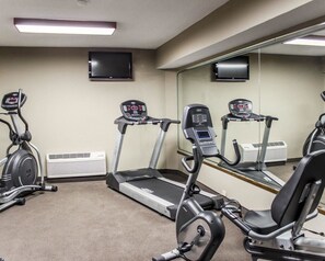 A gym with treadmills, stationary bikes, and a mirrored wall. - Sleep Inn & Suites Spring Lake - Fayetteville near Fort Bragg (Spring Lake)