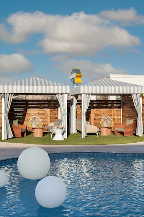 Outdoor pool, open 9:00 AM to 10:00 PM, cabanas (surcharge)