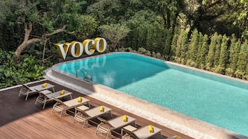 Outdoor pool, open 6:00 AM to 8:00 PM, pool umbrellas