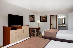 1 habitación y tabla de planchar con plancha