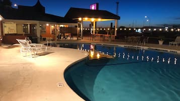 Seasonal outdoor pool, open 9:00 AM to 10:00 PM, pool umbrellas