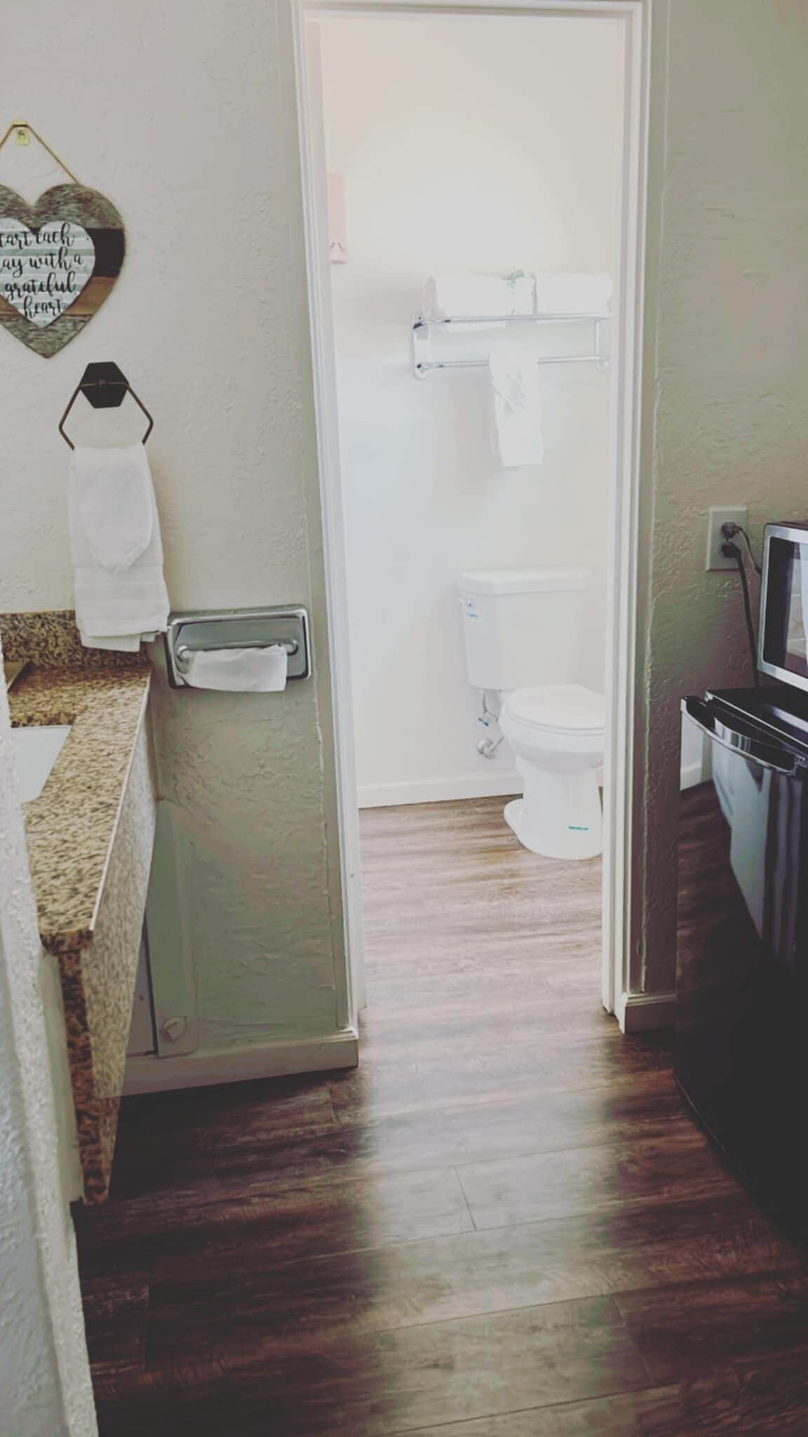 suite, 1 king bed, non smoking | bathroom | rainfall showerhead, free toiletries, hair dryer, towels