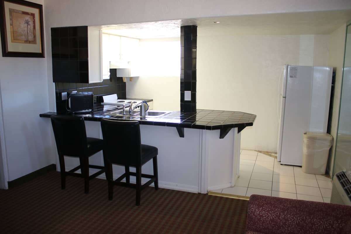 suite, 1 king bed with sofa bed, non smoking, kitchenette | 1 bedroom, desk, blackout curtains, iron/ironing board