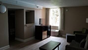 Hypo-allergenic bedding, desk, laptop workspace, blackout drapes