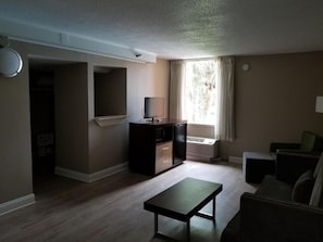 Hypo-allergenic bedding, desk, laptop workspace, blackout drapes