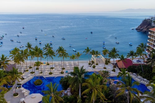 On the beach, sun-loungers, beach towels, surfing