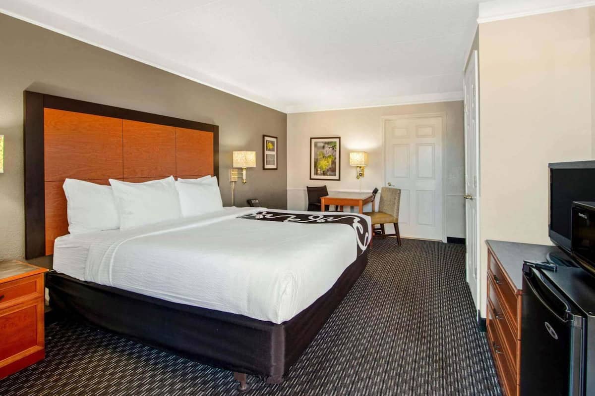 Premium bedding, desk, blackout drapes, iron/ironing board