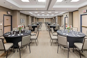 A conference room with multiple tables, chairs, and exit signs. - Country Inn & Suites by Radisson, San Diego North, CA (San Diego)