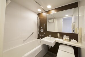 Combined shower/tub, free toiletries, hair dryer, slippers