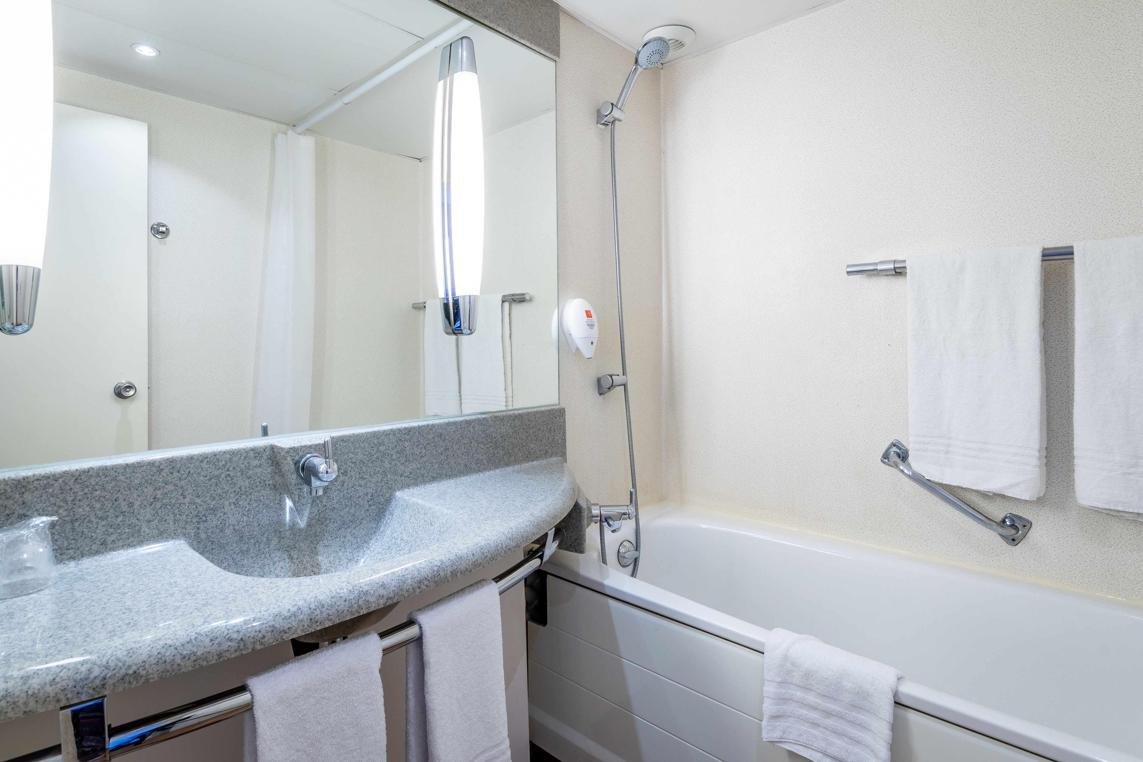 combined shower/bathtub, eco-friendly toiletries, hair dryer, towels