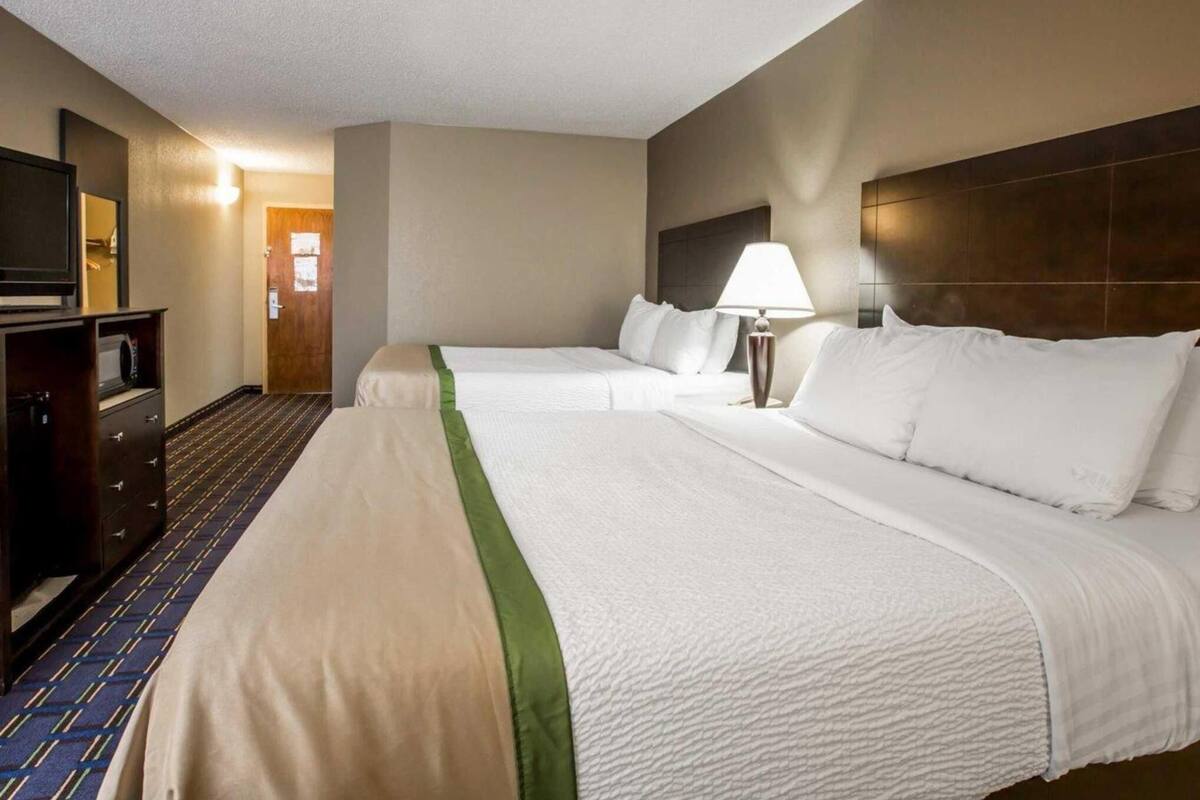 Premium bedding, pillow-top beds, desk, blackout curtains