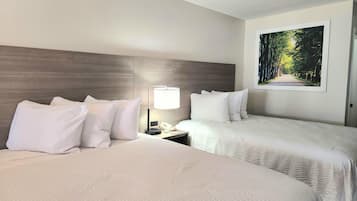 Pillowtop beds, desk, blackout drapes, iron/ironing board