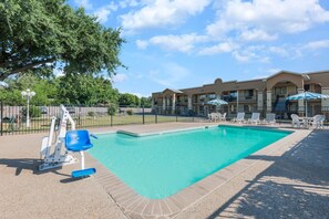 Outdoor pool, open 10 AM to 10 PM, pool umbrellas, pool loungers
