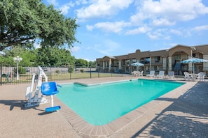 Outdoor pool, open 10 AM to 10 PM, pool umbrellas, pool loungers