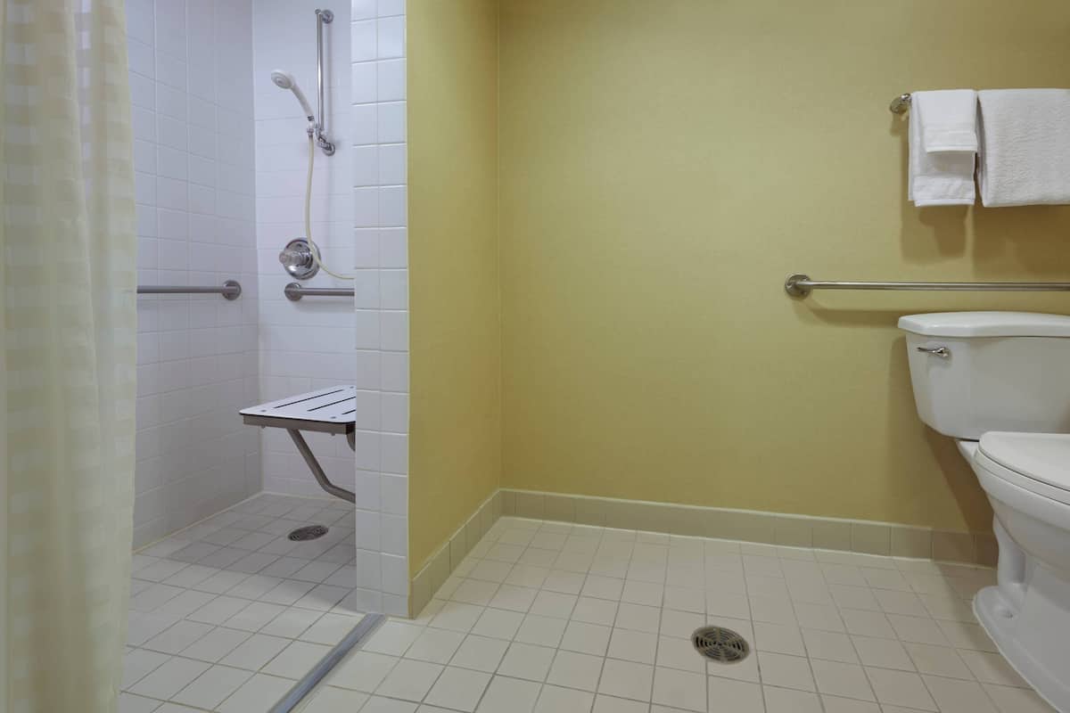 Room, 1 King Bed | Bathroom | Combined shower/tub, free toiletries, hair dryer, towels