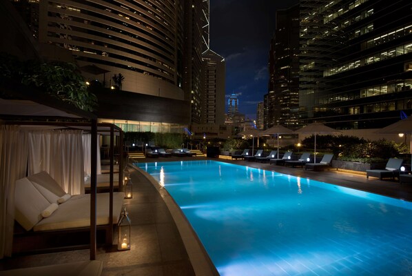 Outdoor pool, open 6:00 AM to 10:00 PM, free cabanas, pool umbrellas