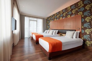 Superior Triple Room | Minibar, in-room safe, desk, laptop workspace