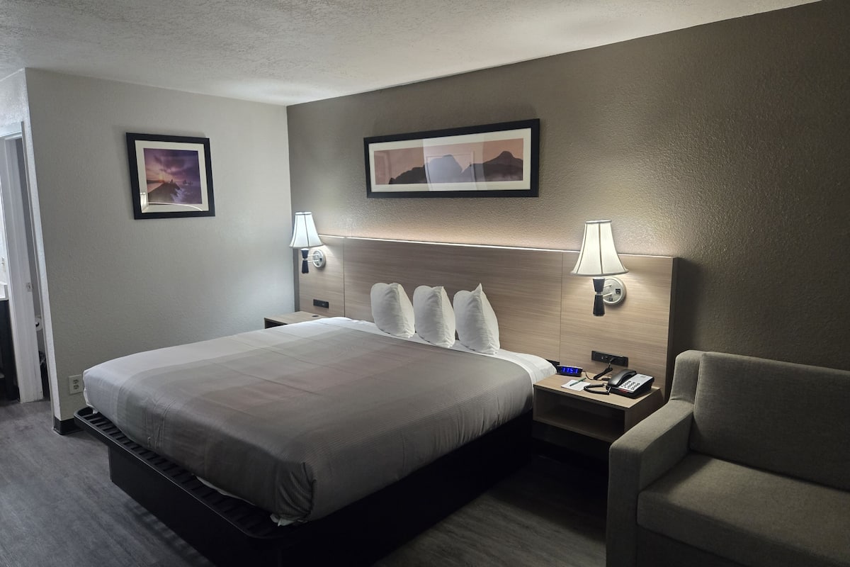 Premium bedding, desk, laptop workspace, blackout curtains