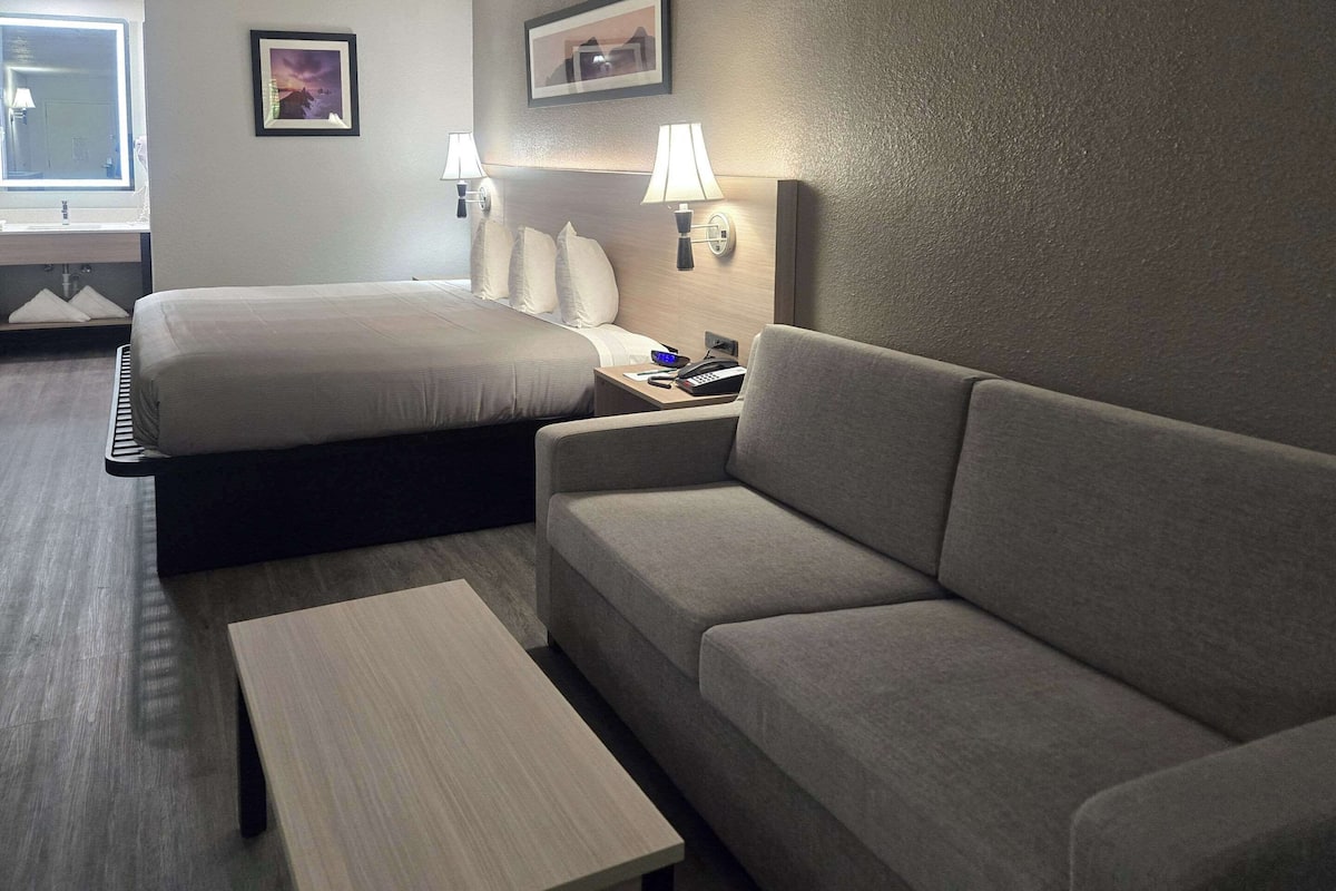 Premium bedding, desk, laptop workspace, blackout curtains