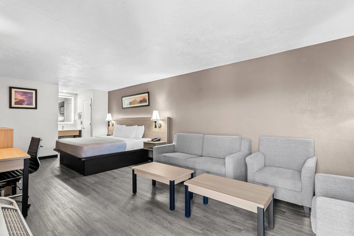 Premium bedding, desk, laptop workspace, blackout curtains