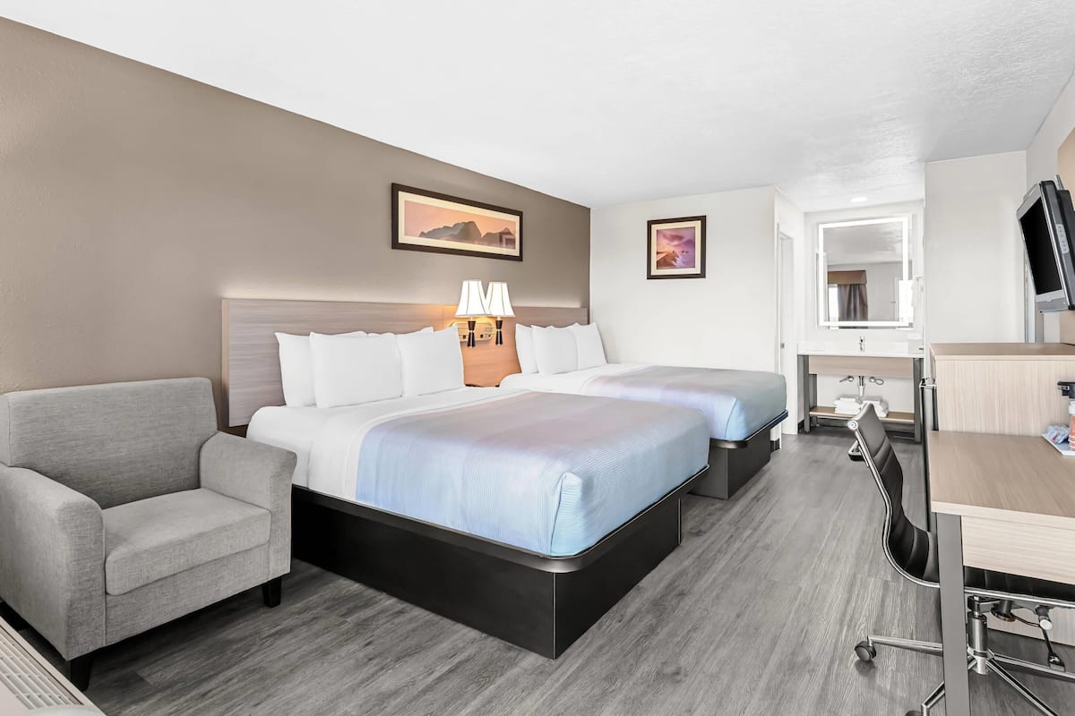 Premium bedding, desk, laptop workspace, blackout curtains