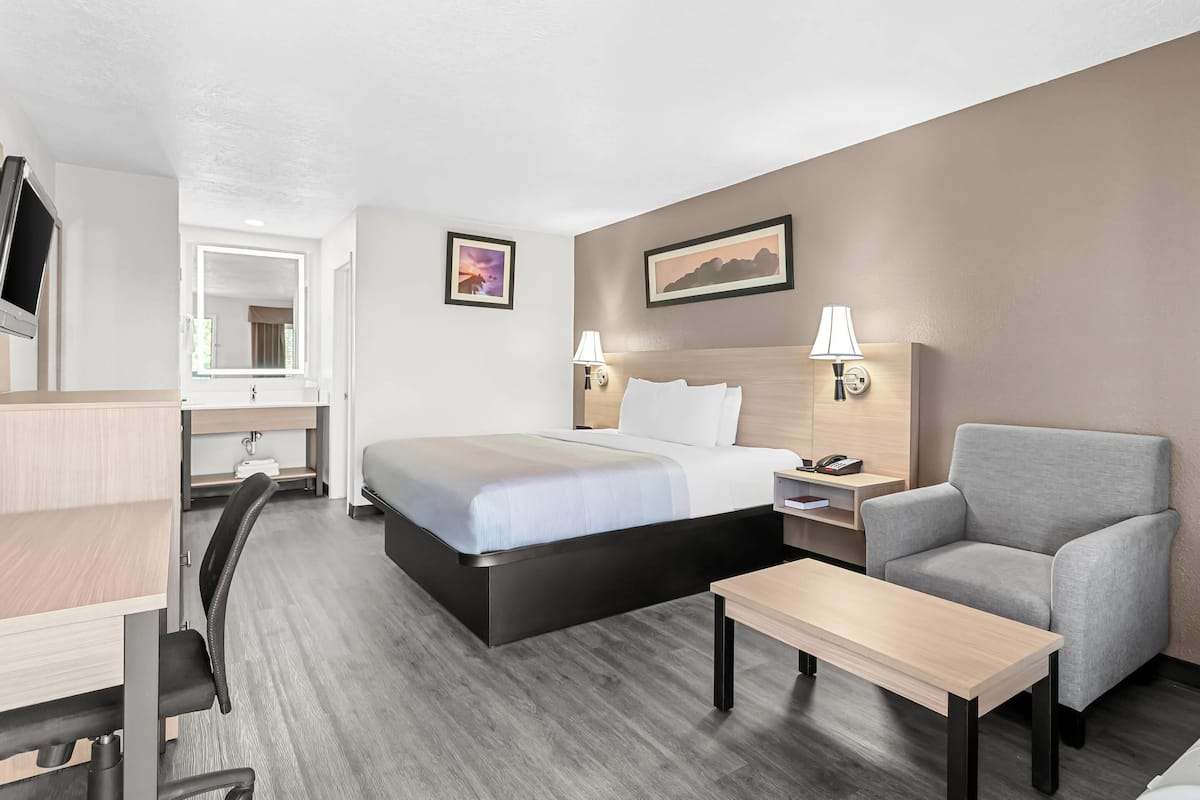 Premium bedding, desk, laptop workspace, blackout curtains